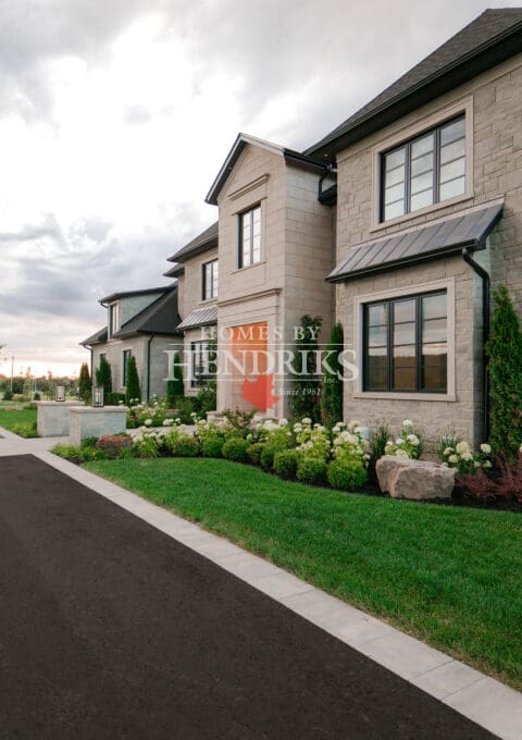 An attractive glimpse of the front doorway of a tailored custom residence, exterior view