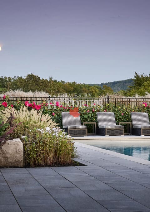 A serene pool and landscaped yard